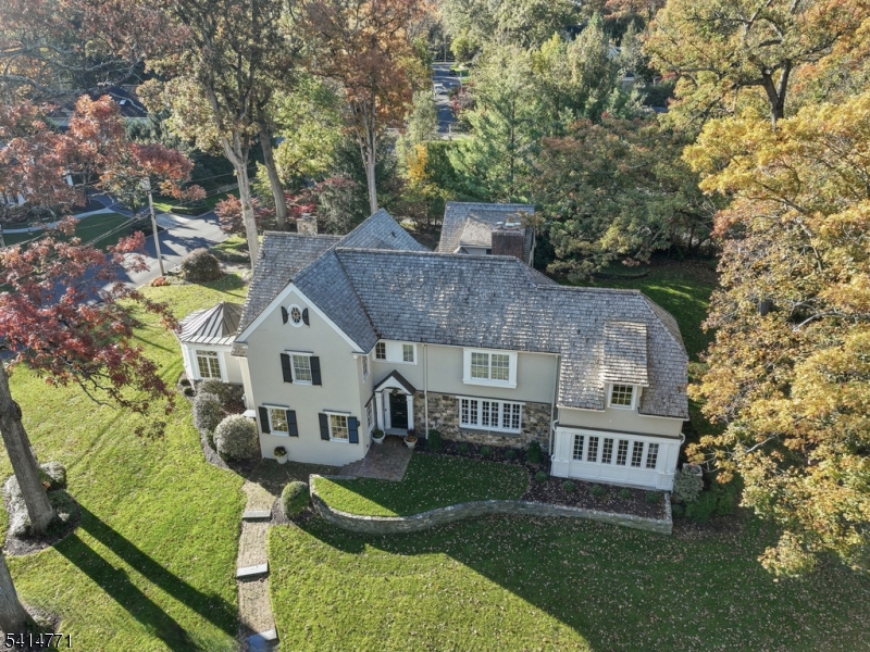 a view of house with a yard and deck