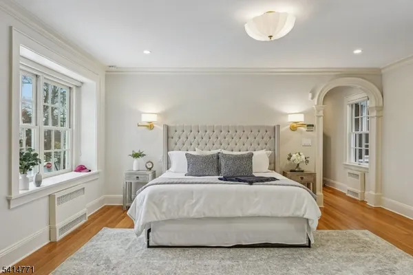 a bathroom with a double vanity sink mirror double shower and a toilet