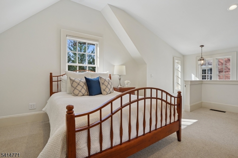 55 Oxbow Lane Summit, NJ 07901 - Photo 33 of 50 a bedroom with furniture and a window