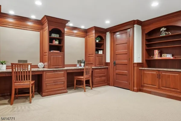 a kitchen with granite countertop a sink stove and refrigerator