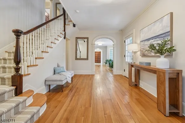 a living room with furniture a fireplace and a large window