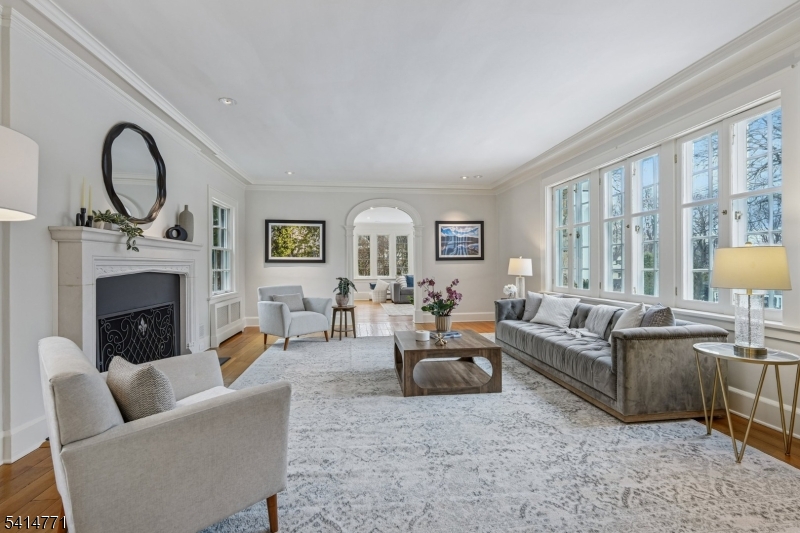 55 Oxbow Lane Summit, NJ 07901 - Photo 5 of 50 a living room with furniture a fireplace and a large window