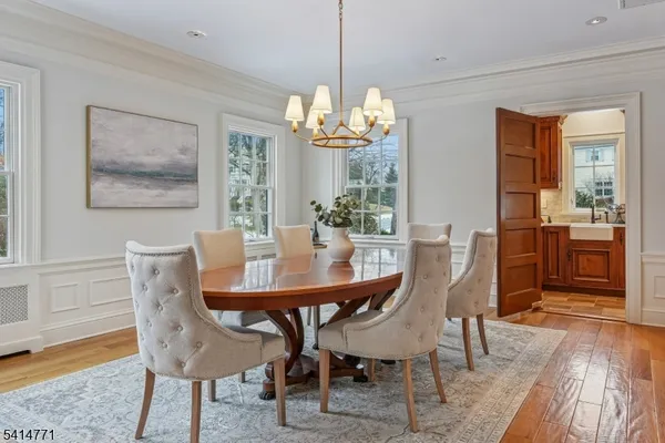 a large kitchen with stainless steel appliances kitchen island granite countertop a large counter top and a stove