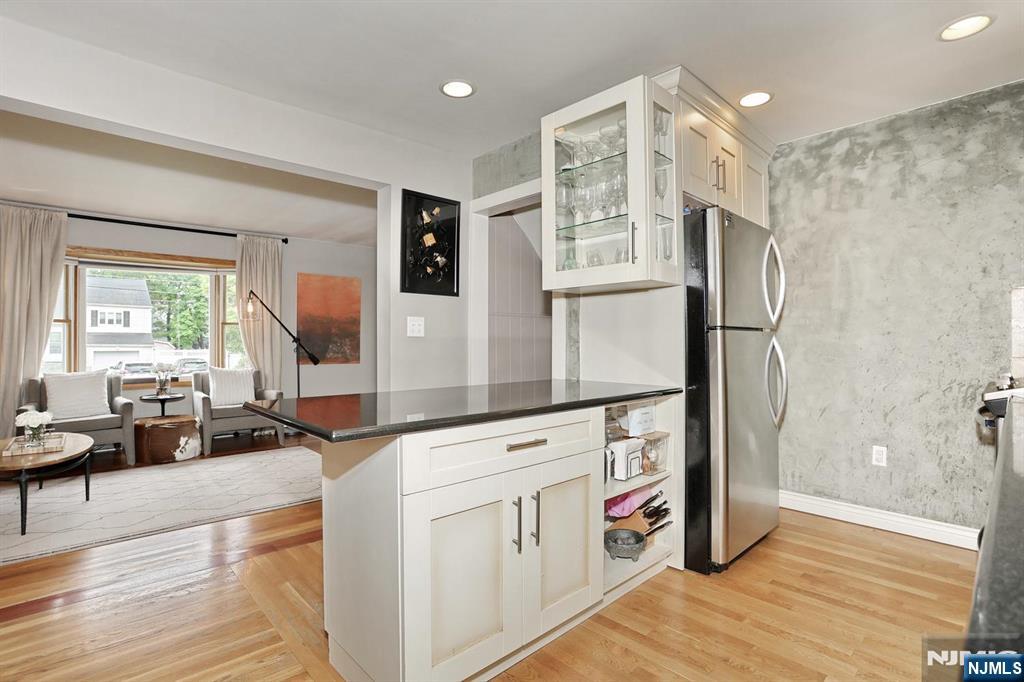 87 Barbara Road Dumont, NJ 07628 - Photo 20 of 48 a kitchen with stainless steel appliances granite countertop a refrigerator and a stove