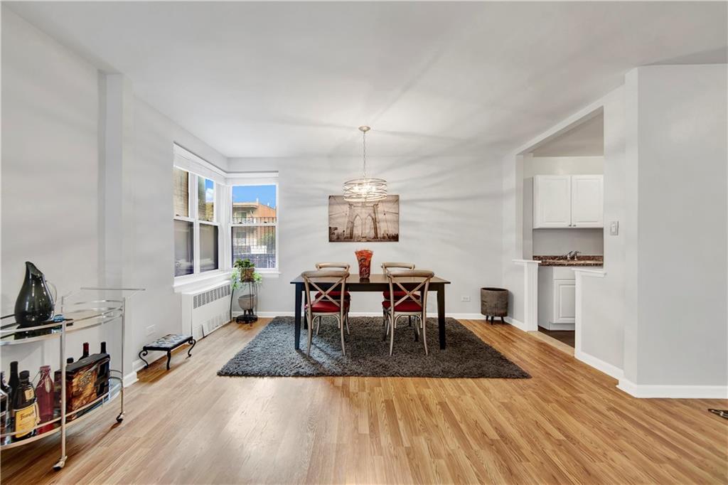 9411 Shore Road, Unit 1A Brooklyn, NY 11209 - Photo 7 of 19 a view of a dining room with furniture and wooden floor