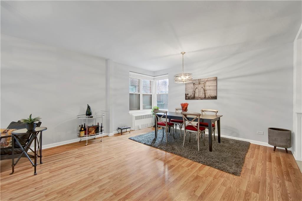 9411 Shore Road, Unit 1A Brooklyn, NY 11209 - Photo 8 of 19 a view of a dining room with furniture and wooden floor