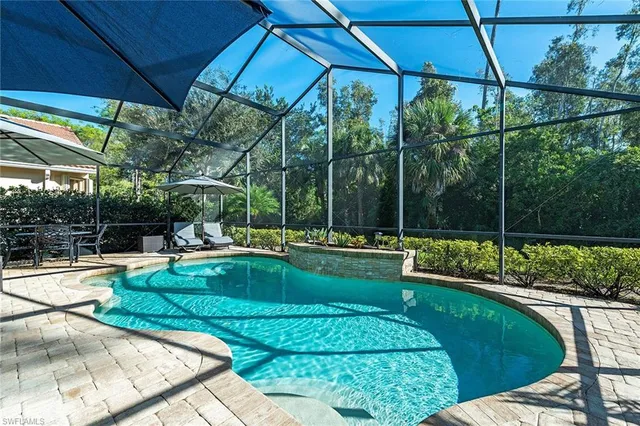 a view of a swimming pool with a patio