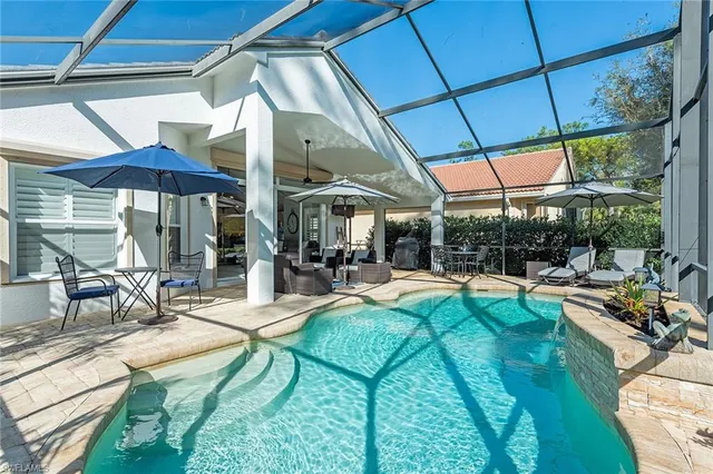 a view of a backyard with swimming pool