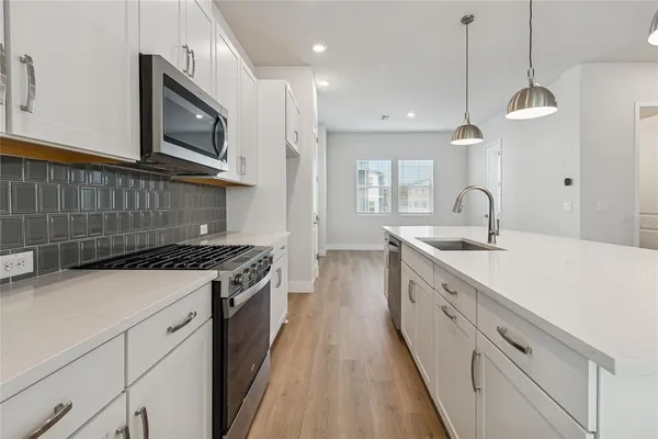 a view of a dining room with furniture and window