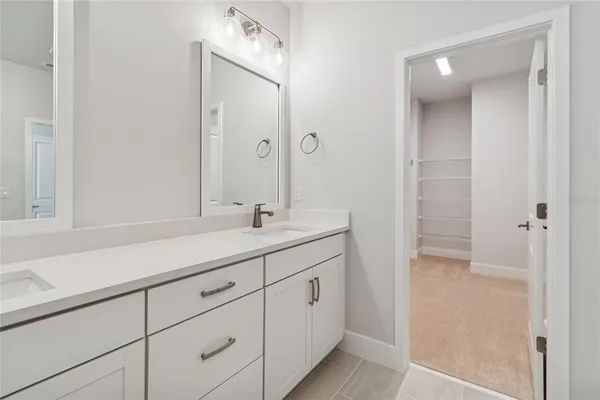 a bathroom with a shower and a sink