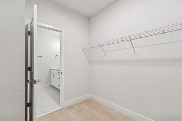 an empty room with a empty space and windows