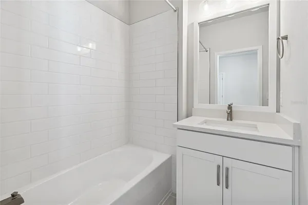 a bathroom with a sink and a bathtub