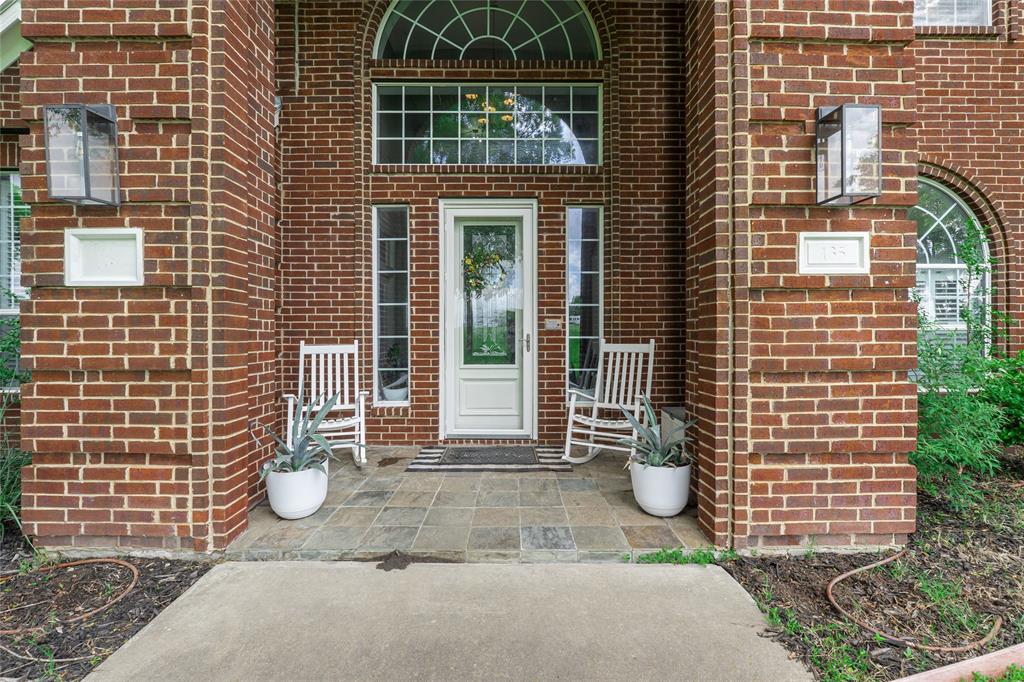 135 Kirkpatrick Road Ennis, TX 75119 - Photo 3 of 40 a view of a door of a house with outdoor space