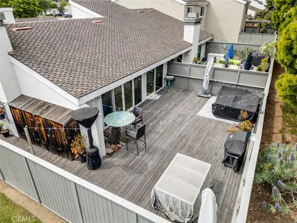 a front view of a house with a yard and a garden