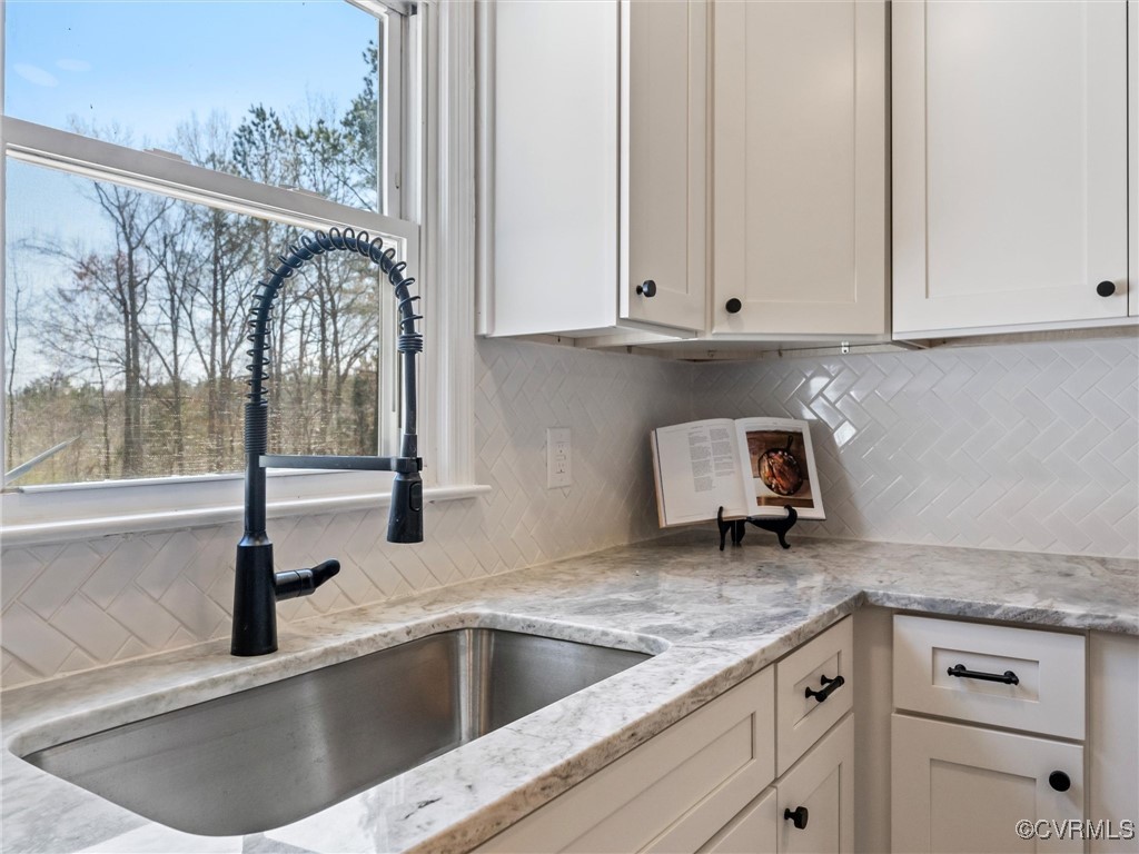 5521 Richmond Road Amelia Court House, VA 23002 - Photo 20 of 49 a kitchen with granite countertop a sink and a window