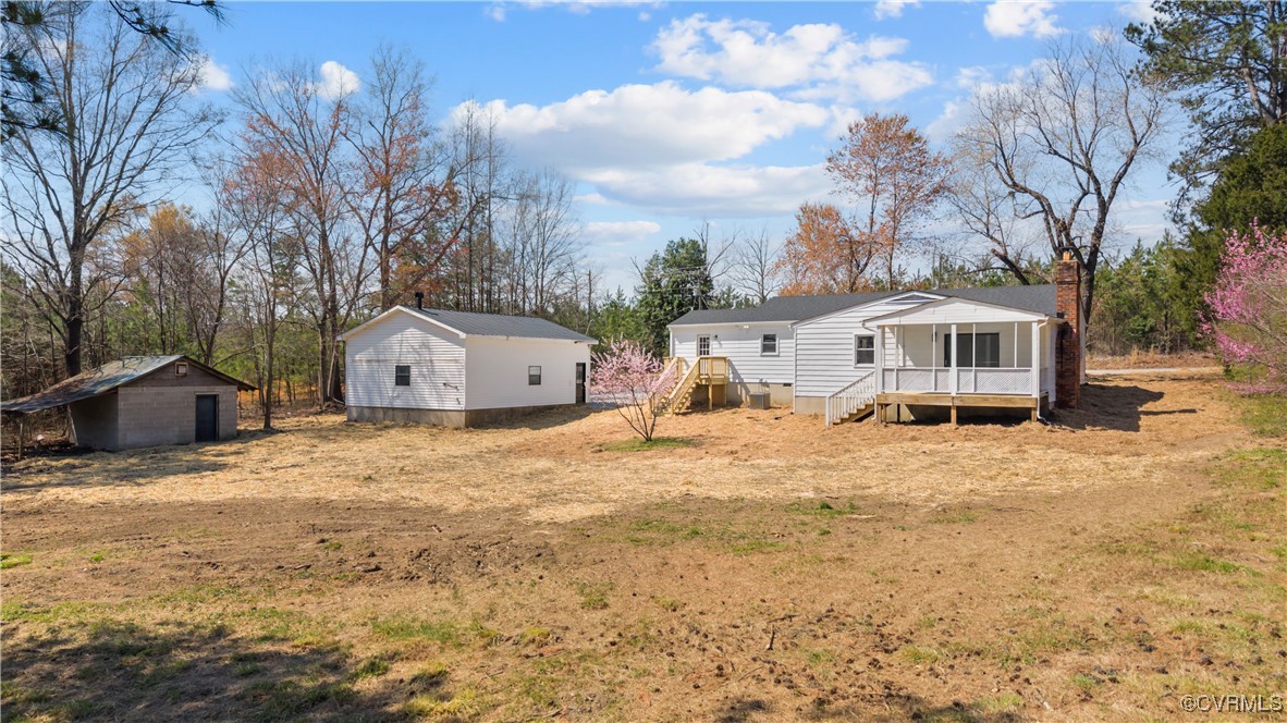 5521 Richmond Road Amelia Court House, VA 23002 - Photo 3 of 49 a front view of house with yard and trees in the background