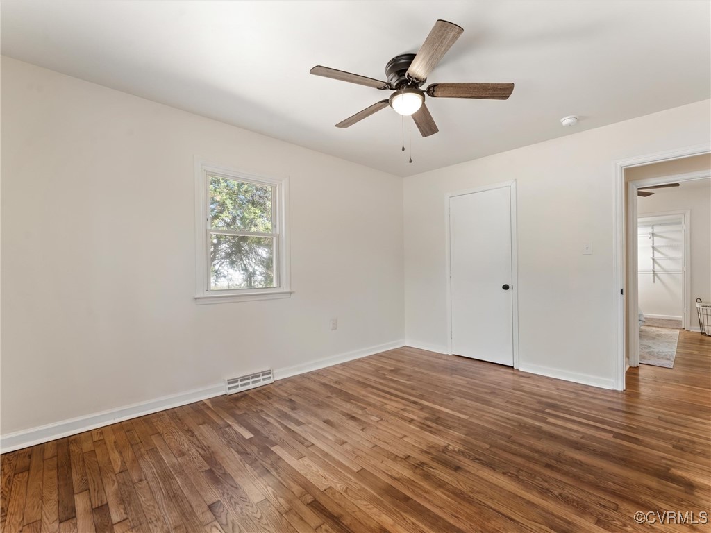 5521 Richmond Road Amelia Court House, VA 23002 - Photo 31 of 49 a view of a big room with wooden floor closet and windows