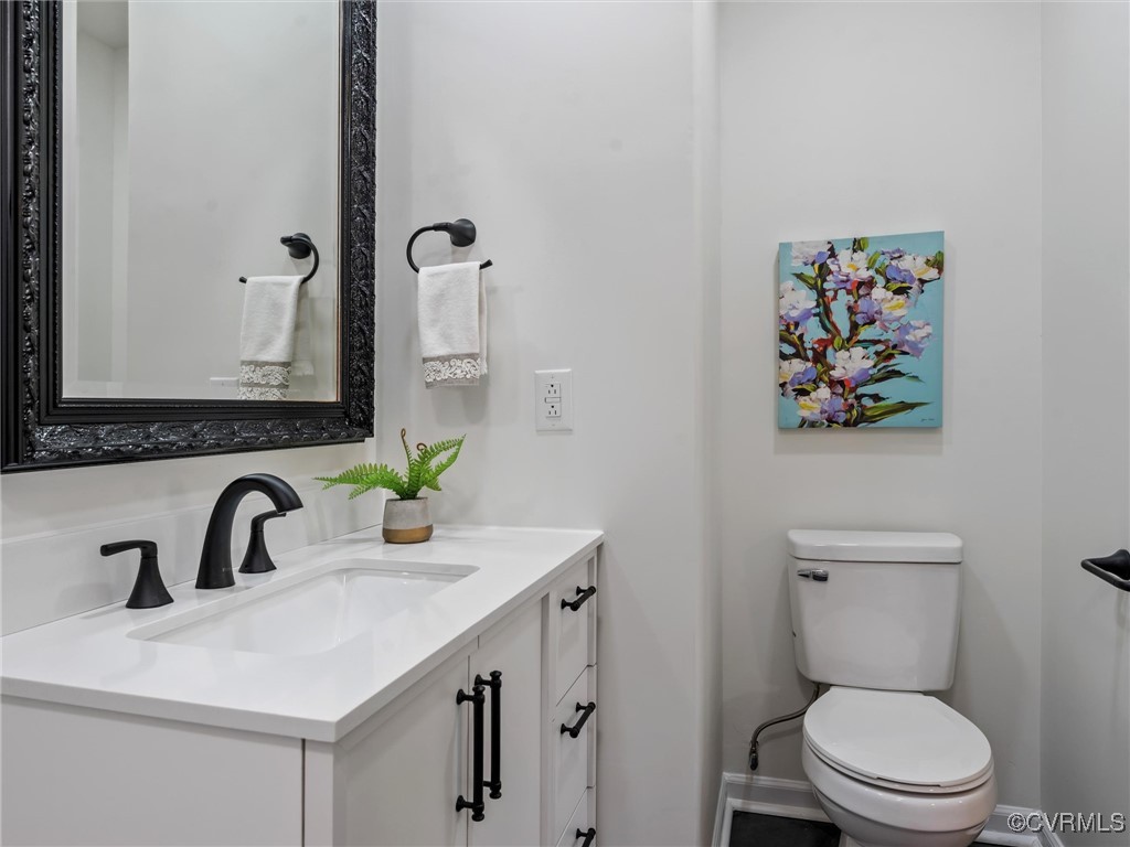 5521 Richmond Road Amelia Court House, VA 23002 - Photo 36 of 49 a bathroom with a toilet sink and mirror