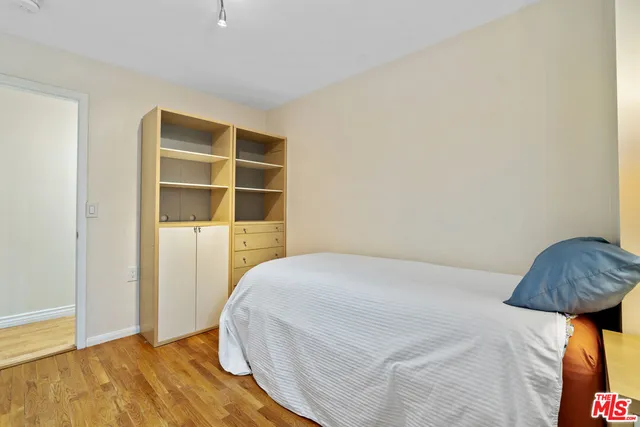 a bedroom with a bed and a cabinets