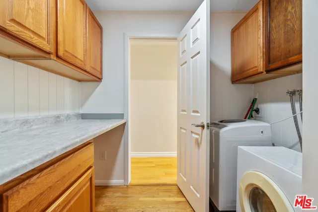 a view of a storage & utility room with washer and dryer