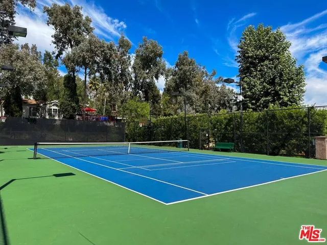 a view of an outdoor space and tennis court
