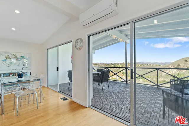 a view of a living room and dining room