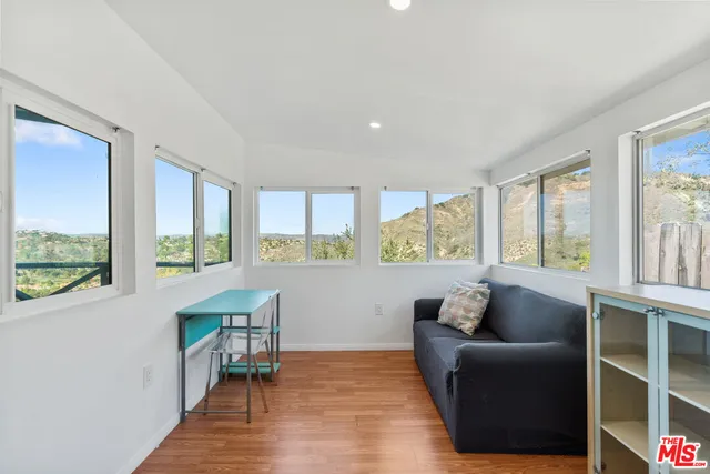 a living room with furniture and windows