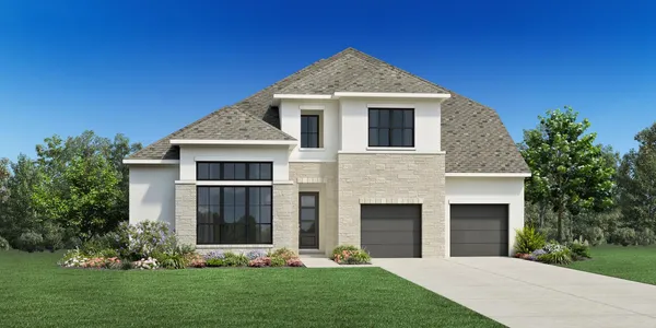 a front view of a house with a garden and yard