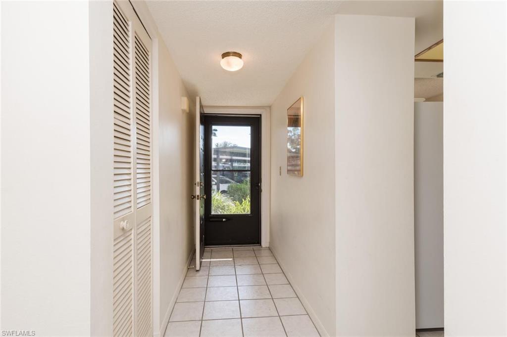 4973 Pepper Circle, Unit F105 Naples, FL 34113 - Photo 3 of 20 a view of an entryway door