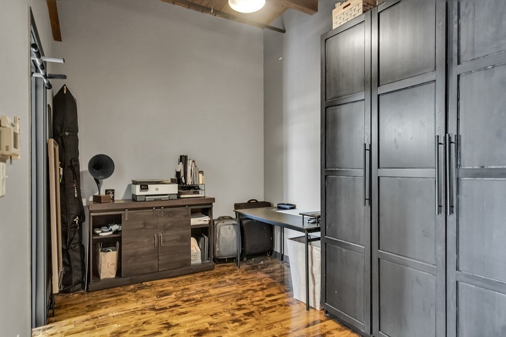 210 Broadway, Unit 103 Everett, MA 02149 - Photo 14 of 16 a kitchen with a refrigerator and a sink