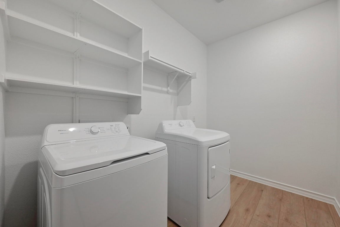 1613 Dove Rnch Road Georgetown, TX 78628 - Photo 17 of 29 a utility room with dryer and washer