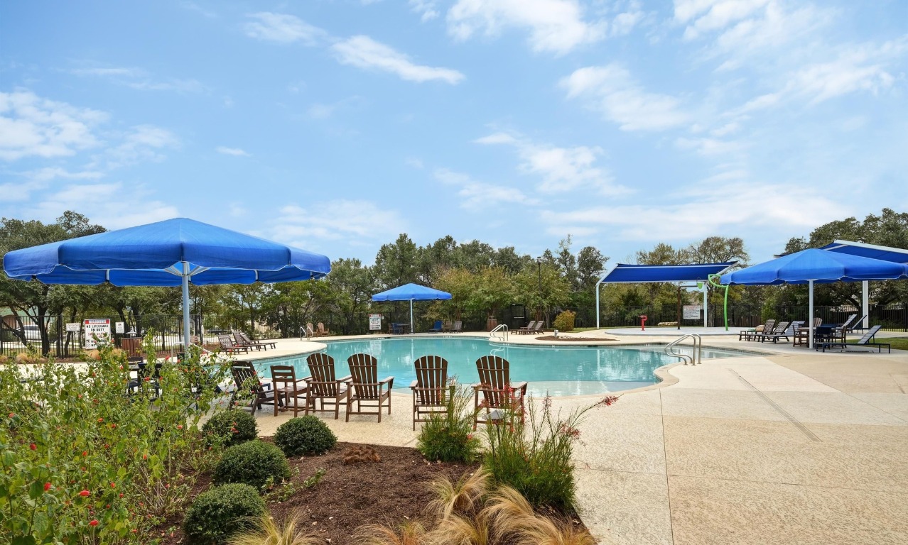 1613 Dove Rnch Road Georgetown, TX 78628 - Photo 24 of 29 a view of a swimming pool with a patio and a yard