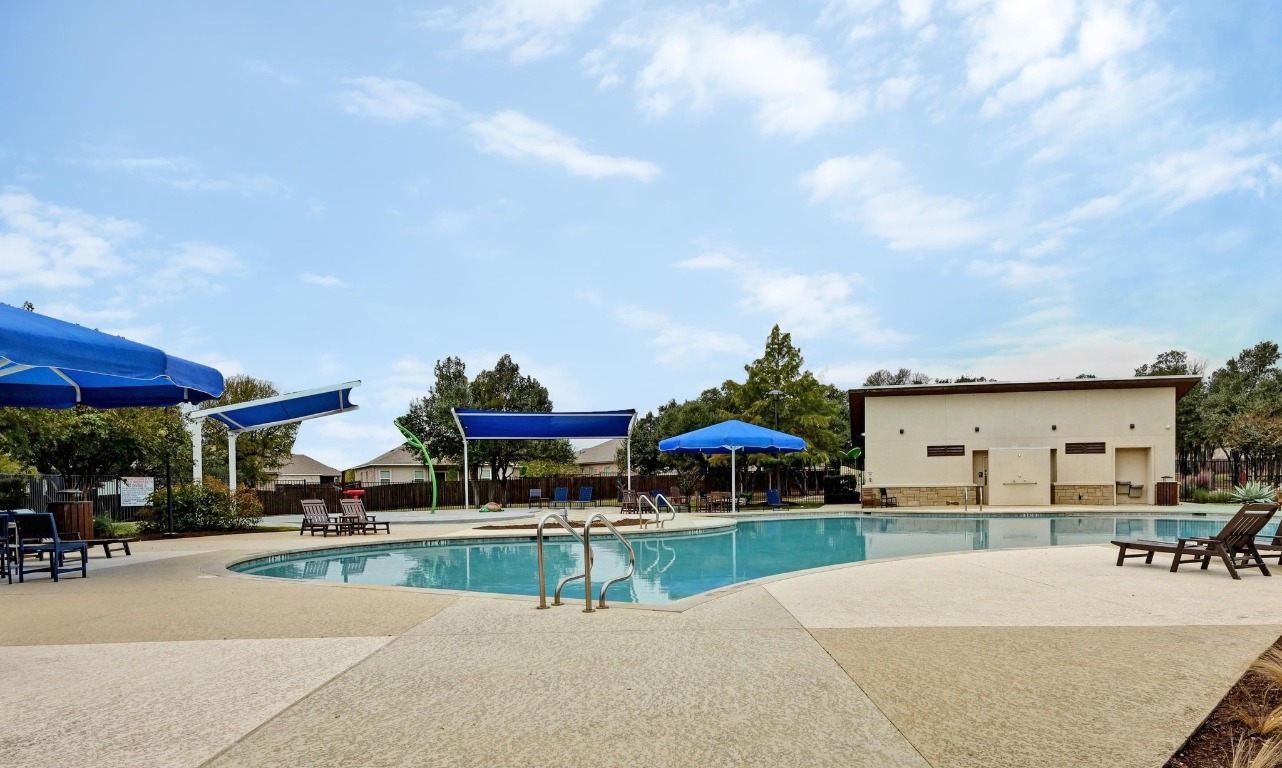 1613 Dove Rnch Road Georgetown, TX 78628 - Photo 25 of 29 a swimming pool with outdoor seating and yard