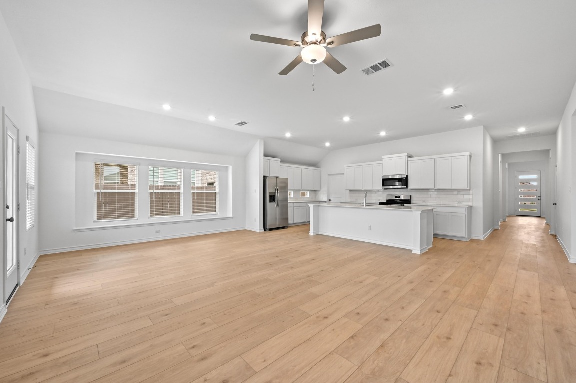 1613 Dove Rnch Road Georgetown, TX 78628 - Photo 29 of 29 a view of an empty room with kitchen and window
