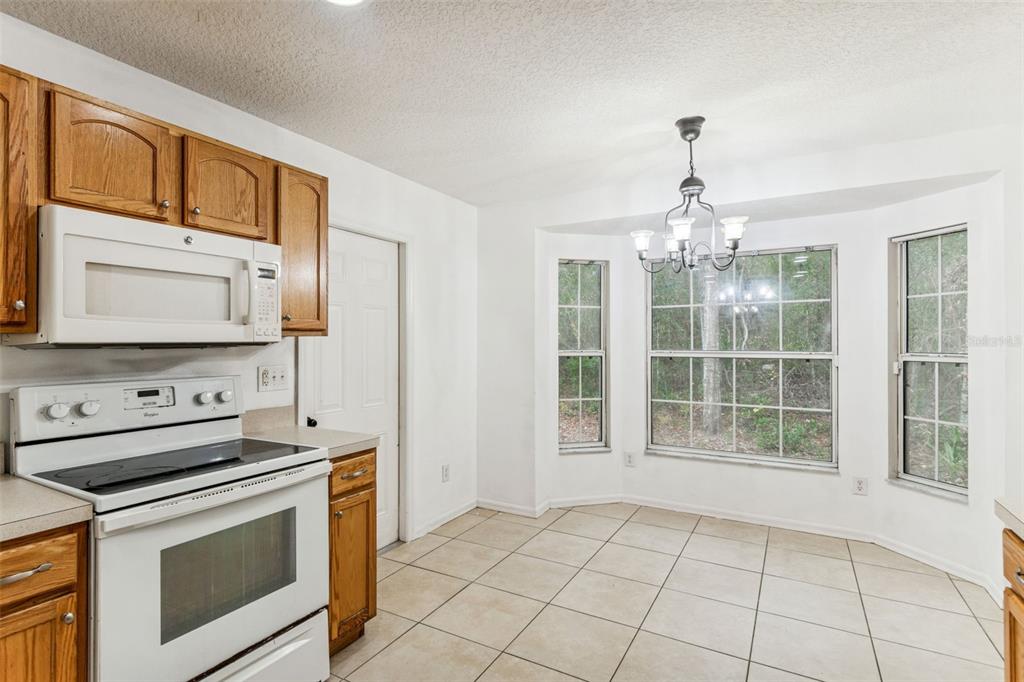 14 South Charles Avenue Inverness, FL 34453 - Photo 11 of 25 a kitchen with a stove oven and a sink