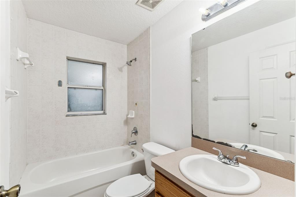 14 South Charles Avenue Inverness, FL 34453 - Photo 16 of 25 a bathroom with a sink toilet and shower