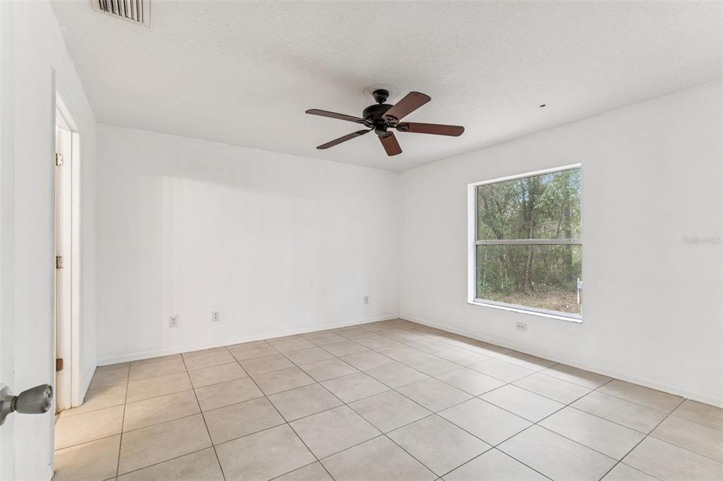 14 South Charles Avenue Inverness, FL 34453 - Photo 19 of 25 a view of an empty room with a window