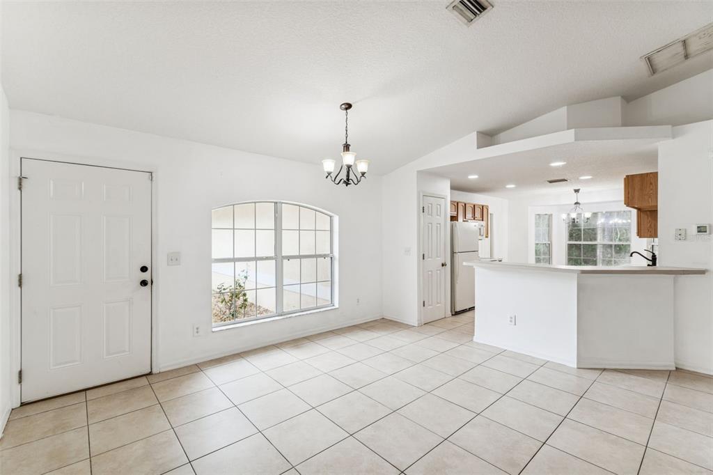14 South Charles Avenue Inverness, FL 34453 - Photo 5 of 25 a view of an empty room with window and cabinet
