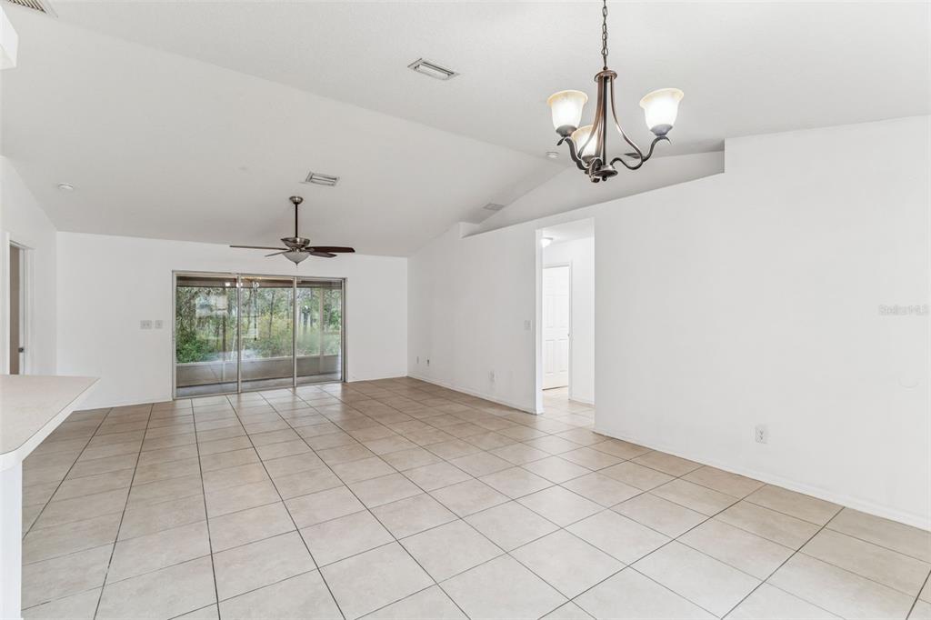 14 South Charles Avenue Inverness, FL 34453 - Photo 7 of 25 a view of an empty room with a chandelier