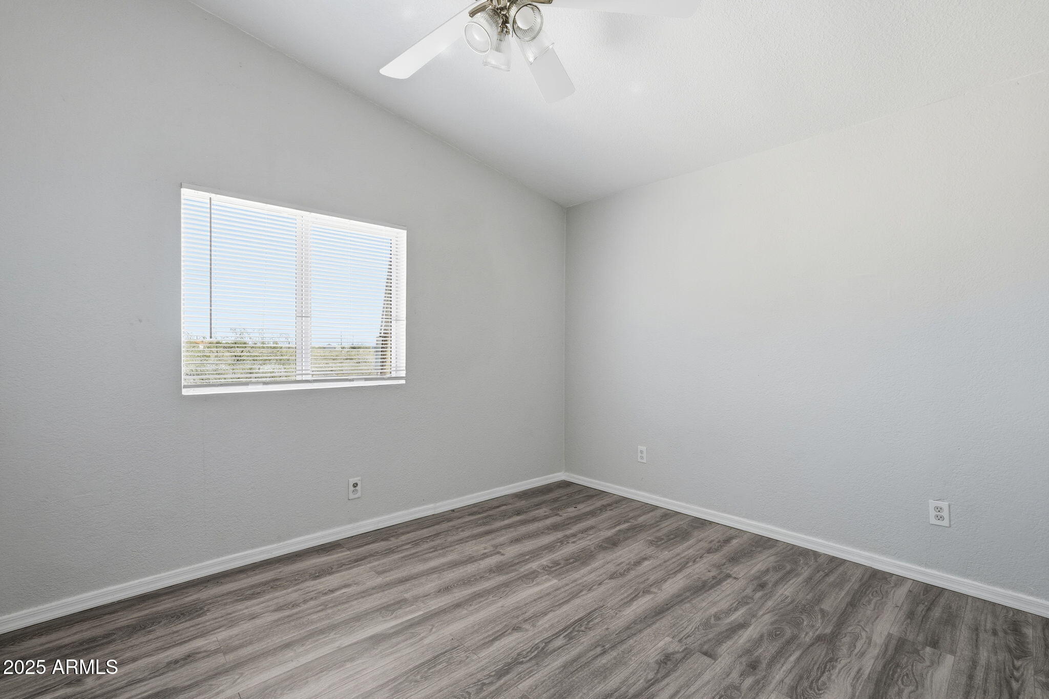 25100 East Lori Road Benson, AZ 85602 - Photo 16 of 30 an empty room with a window