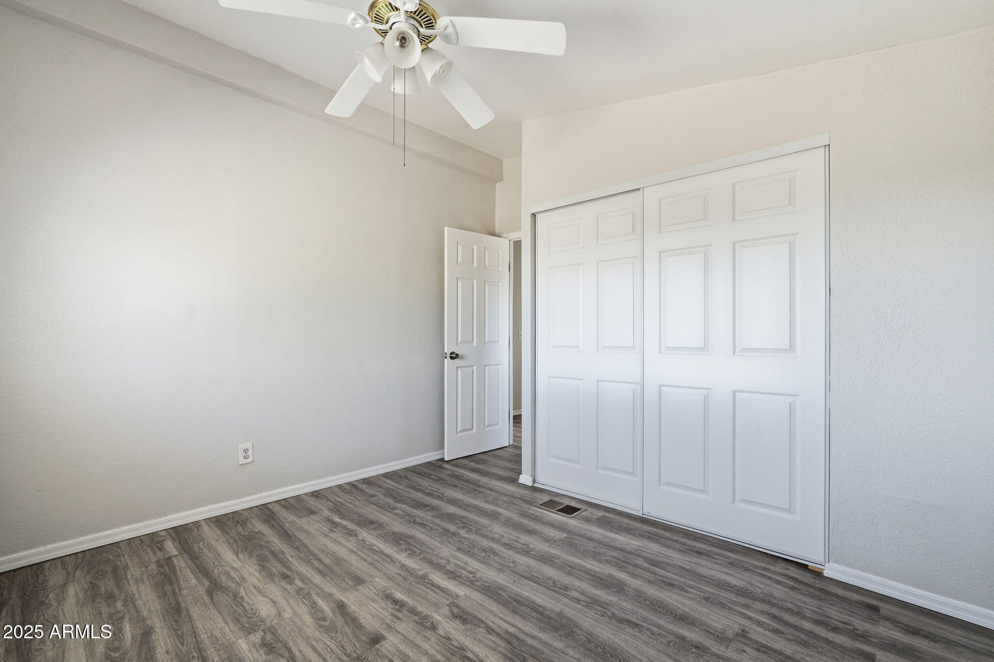 25100 East Lori Road Benson, AZ 85602 - Photo 19 of 30 wooden floor in an empty room