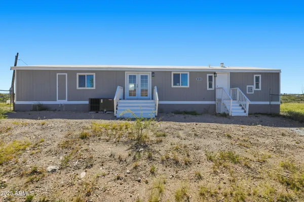 a house view with a backyard space