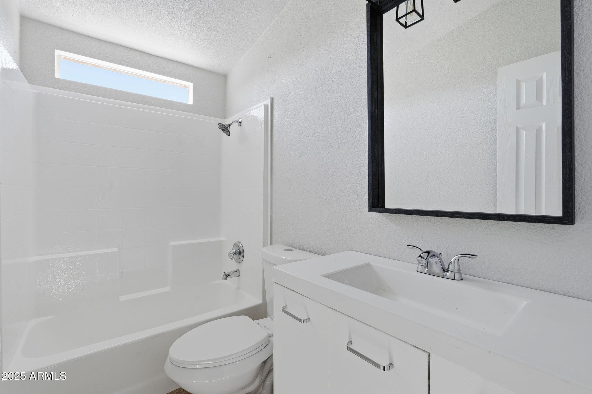 25100 East Lori Road Benson, AZ 85602 - Photo 23 of 30 a bathroom with a granite countertop sink a toilet and shower