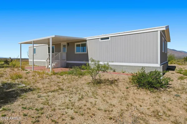 a backyard of a house with garden
