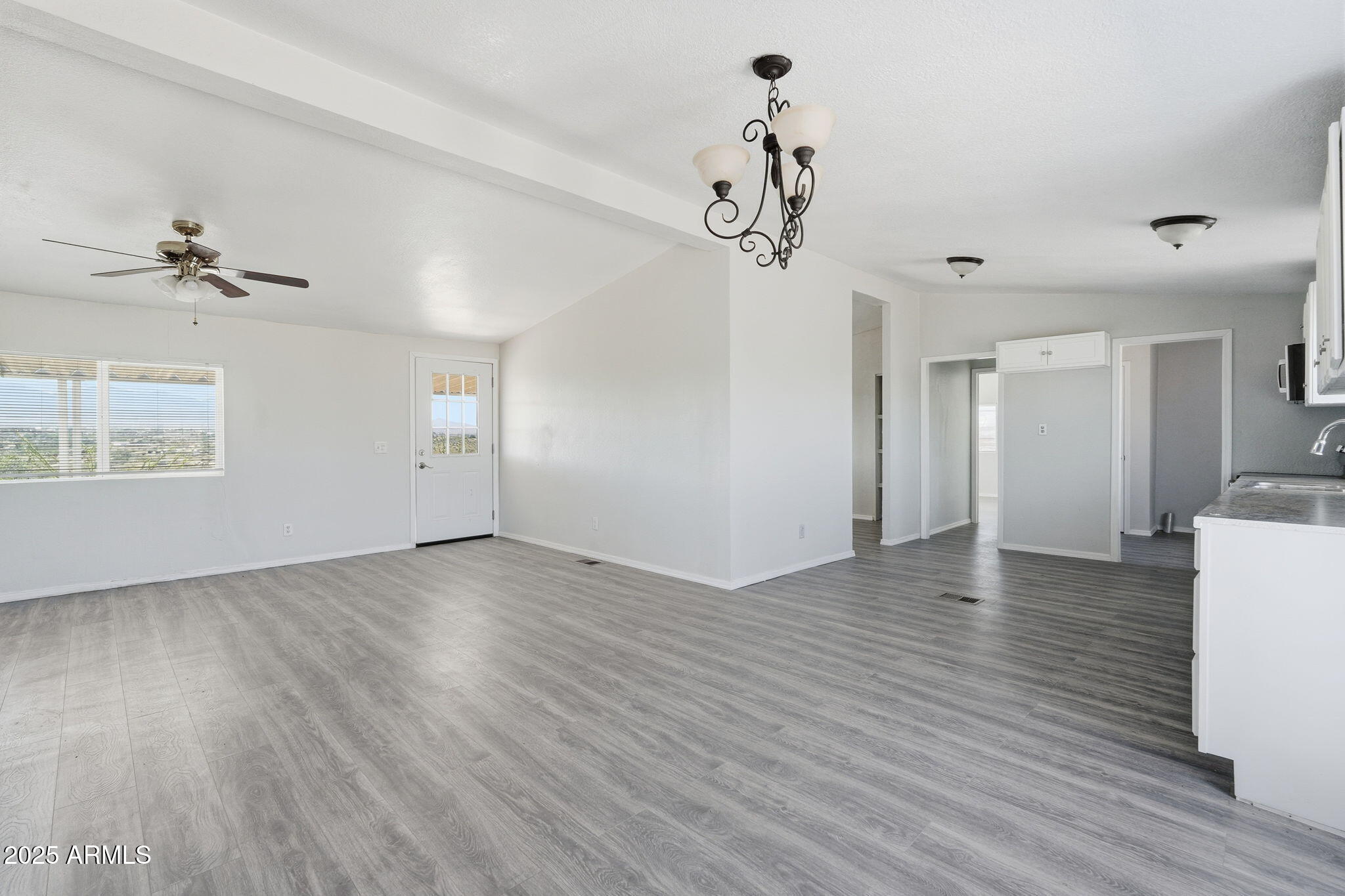 25100 East Lori Road Benson, AZ 85602 - Photo 3 of 30 wooden floor in an empty room with a window