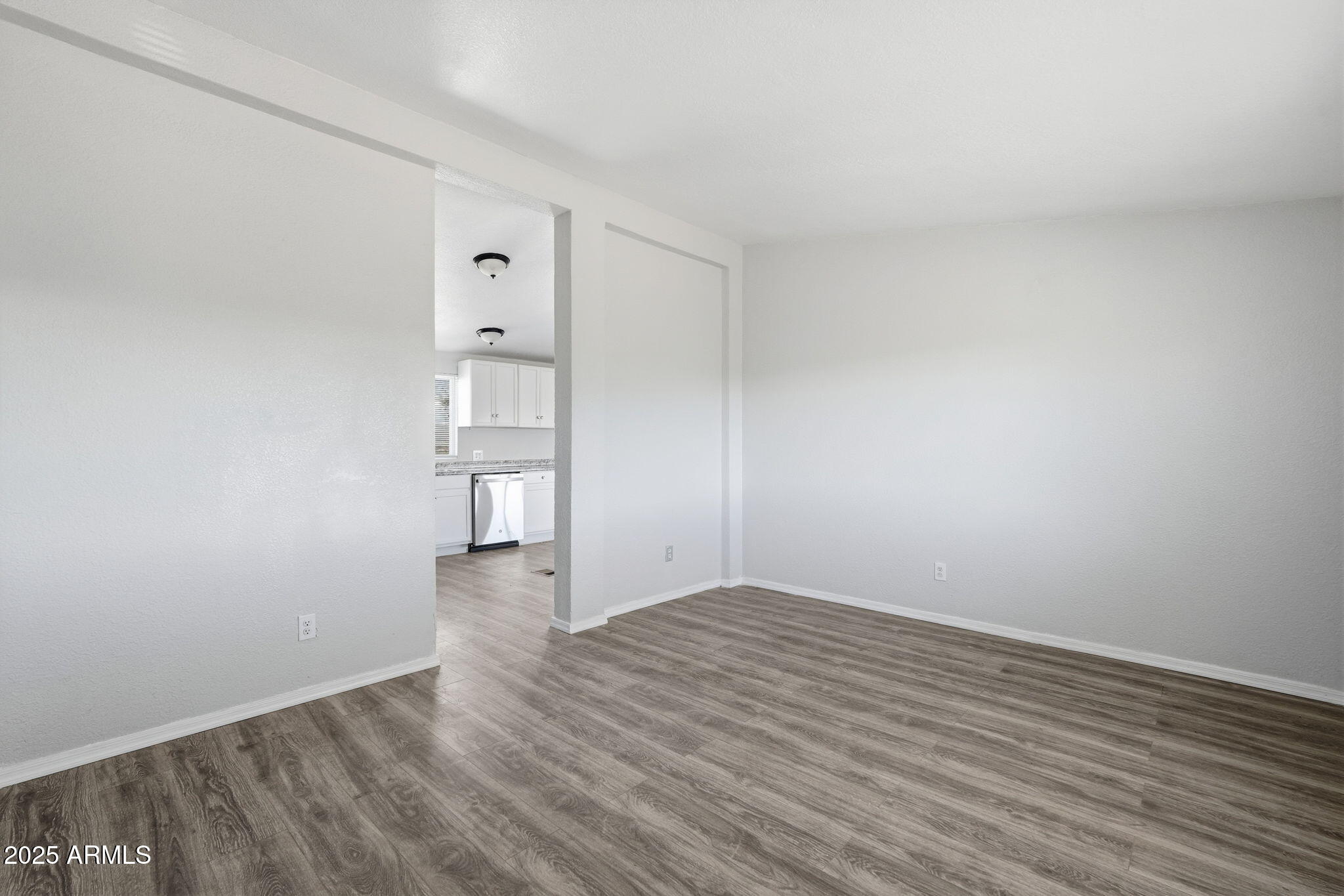 25100 East Lori Road Benson, AZ 85602 - Photo 10 of 30 wooden floor in an empty room