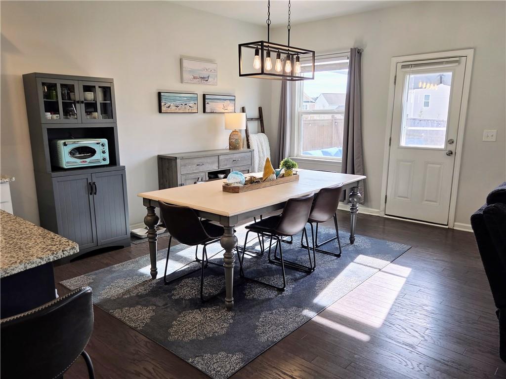 3042 Lowell Road Bethlehem, GA 30620 - Photo 15 of 53 a view of a dining room with furniture window and wooden floor