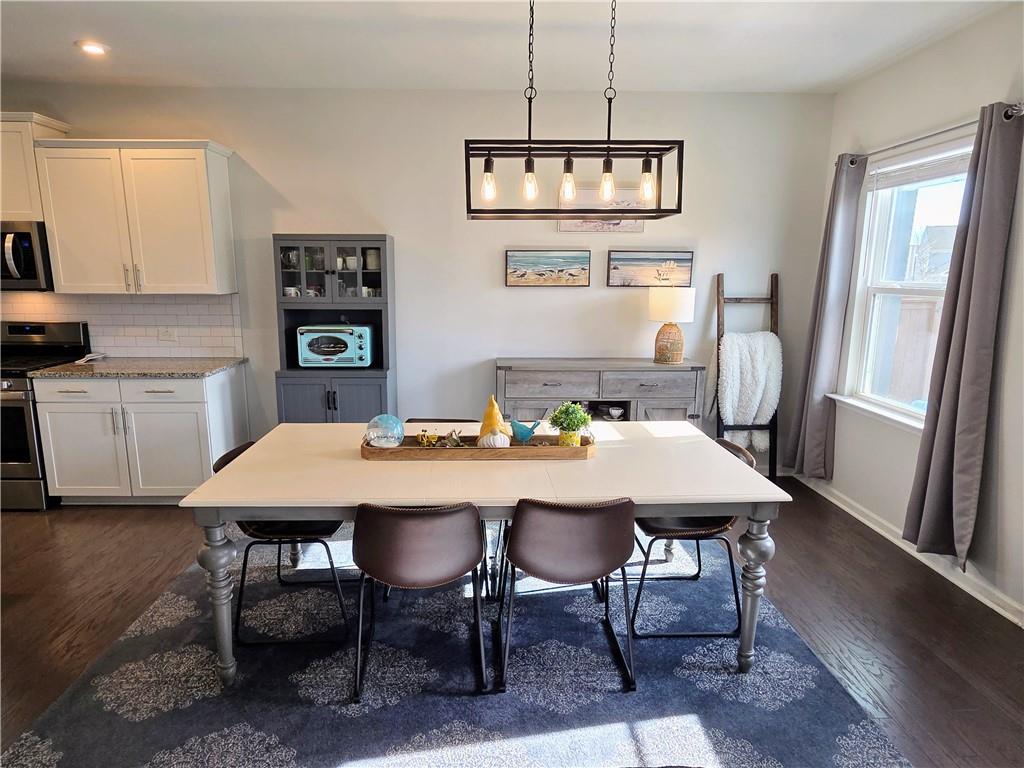 3042 Lowell Road Bethlehem, GA 30620 - Photo 17 of 53 a view of a dining room with furniture window and wooden floor
