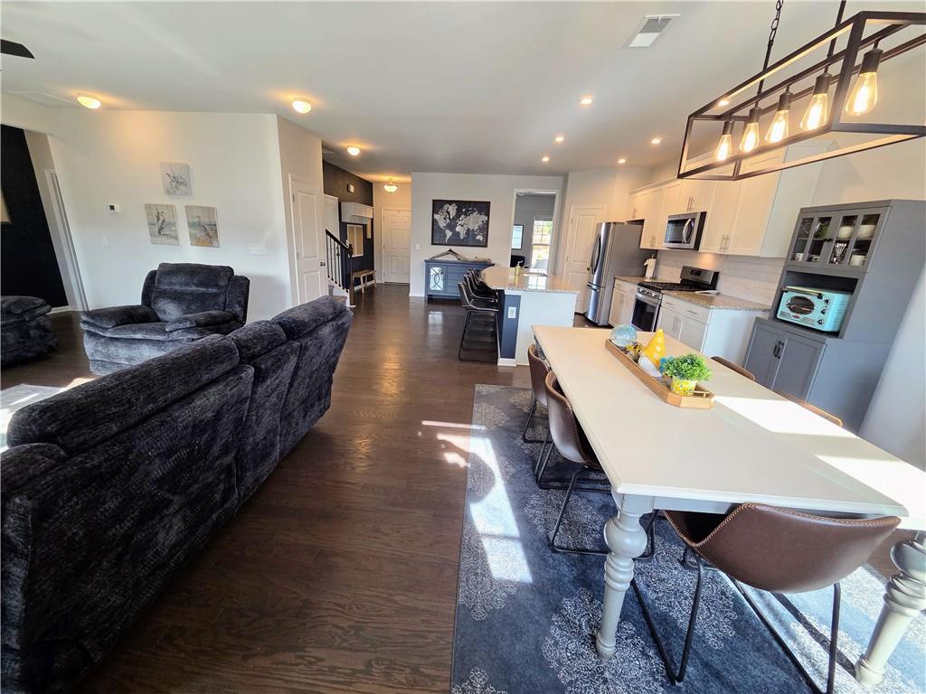 3042 Lowell Road Bethlehem, GA 30620 - Photo 19 of 53 a large kitchen with a table and chairs