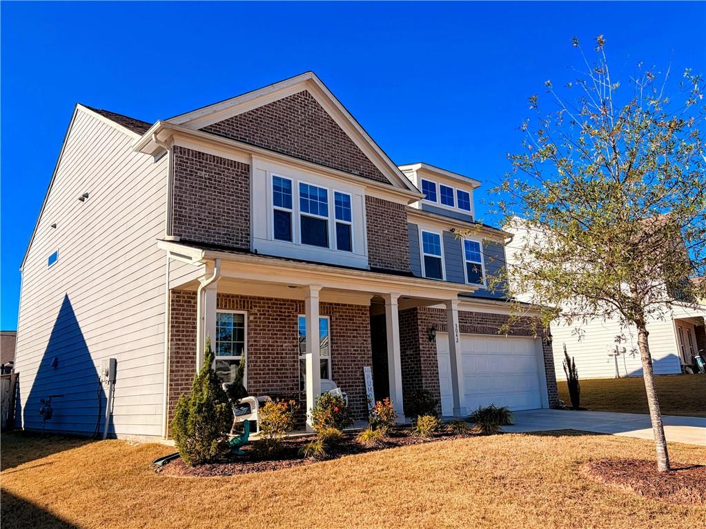 3042 Lowell Road Bethlehem, GA 30620 - Photo 2 of 53 a front view of a house with a yard